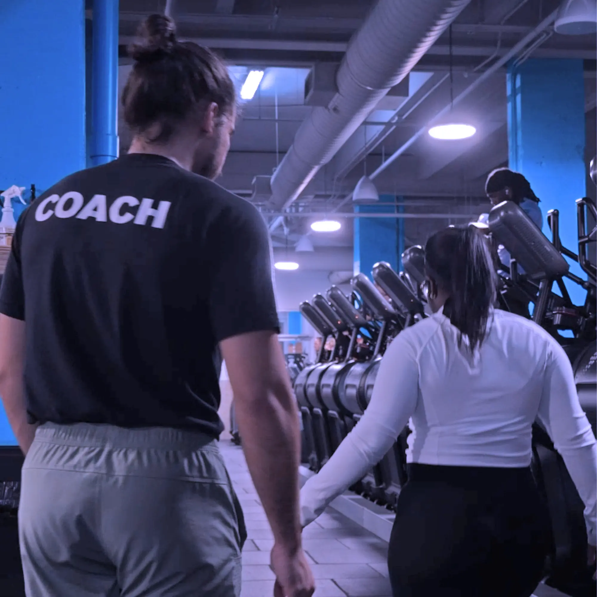 Personal training session Miami Coach Argota helping client with strength training