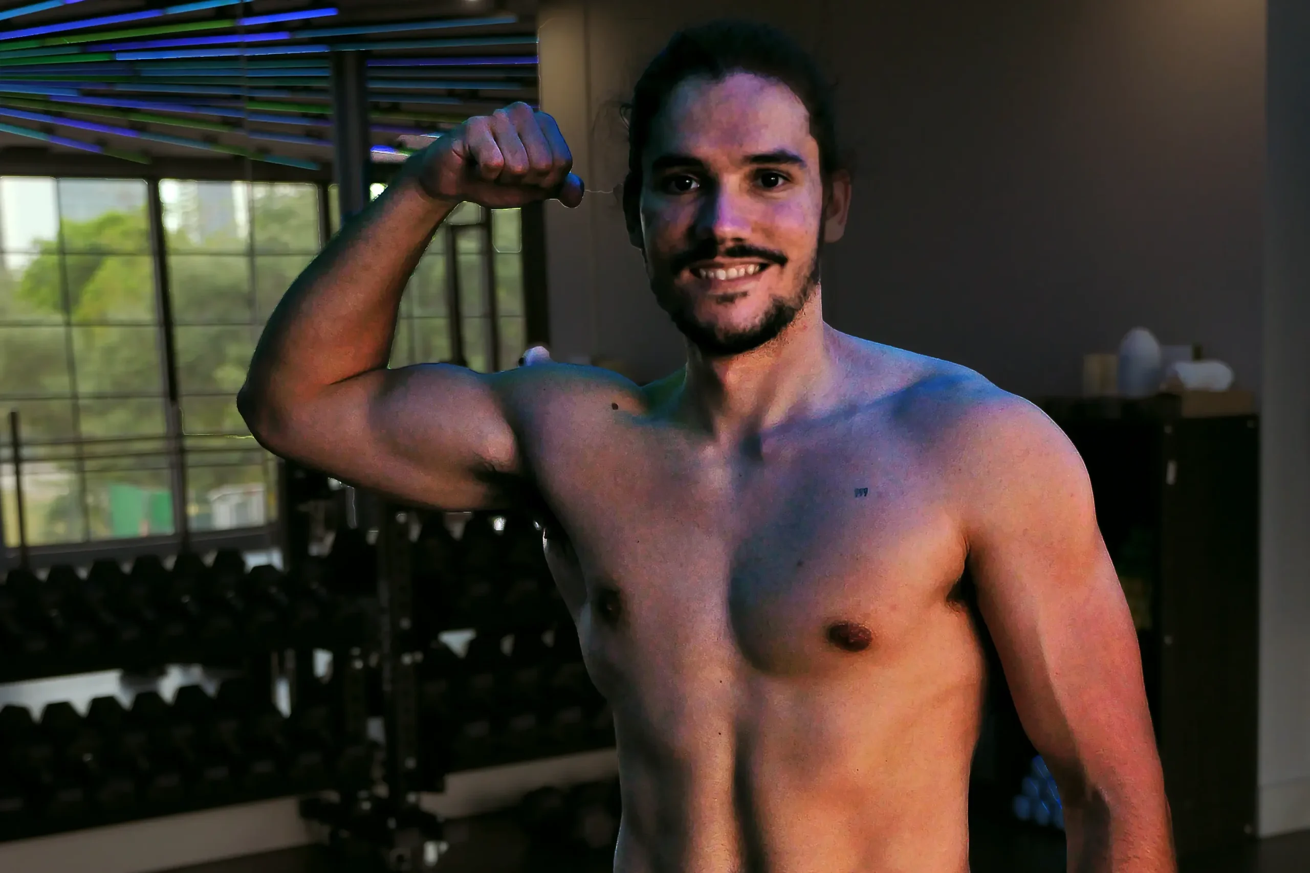 Miami personal trainer Coach Argota demonstrating fitness results at premium gym facility